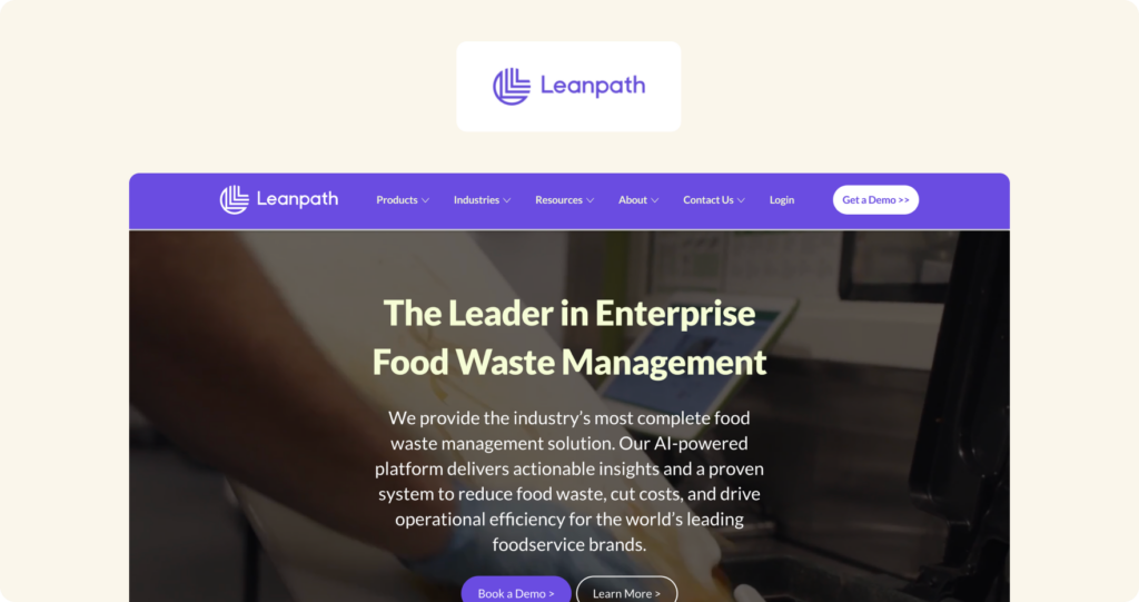 Leanpath homepage showing a purple navigation bar and hero section with headline "The Leader in Enterprise Food Waste Management" over a kitchen background image.